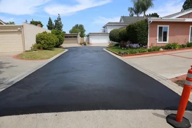 Driveway paving and blacktop replacement in Pocatello — new asphalt, gravel-to-pavement, mill-and-overlay, and full-depth tear-out before winter.