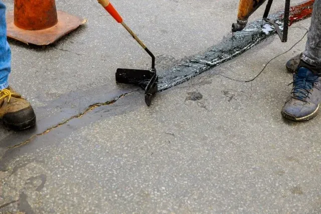 Pothole repair, asphalt patching, and crack sealing in Pocatello for driveways, parking lot aisles, and private lanes not ready for full replacement.